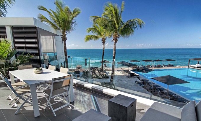El Batey Apartment | 2BD beachfront condo in gated luxury residence, gym/pool, near everything