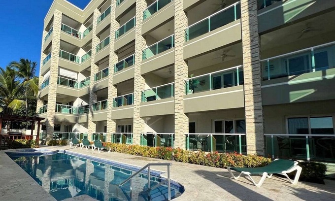 El Batey Apartment | 2BD sea-views condo, guest-friendly, steps from sandy beach and clubs