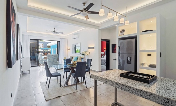 El Batey Apartment | Modern 1BR at Rizz Suites Pool Access Walk to Beach King Bed Strong AC