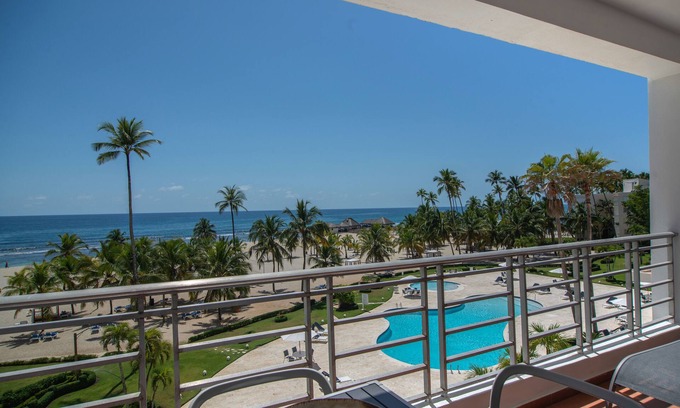 Juan Dolio Apartment | Trendy Beach Scene at a Harmony Beachfront Condo in Costa del Sol
